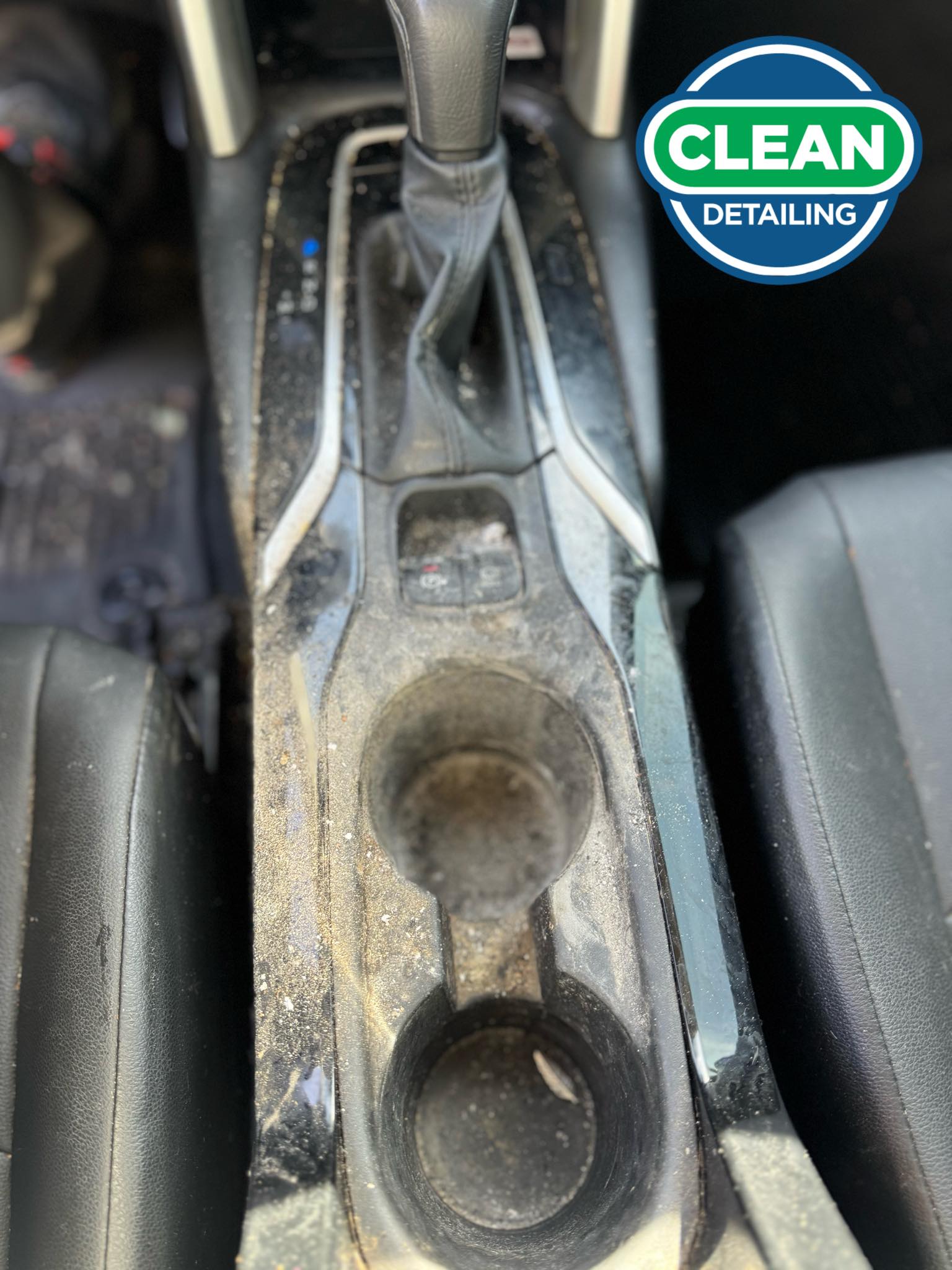 The before photo of the clean center console of a vehicle before a car detailing appointment at Clean Car Wash and Detail in Fredericksburg, VA.